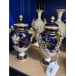 19th cent. Royal Worcester blush urn vases, hand decorated with wild flowers, gilt handles to side