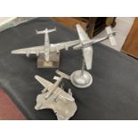 Collection of three aluminium models of aircraft on stands including a Lancaster and Stuka. (3)