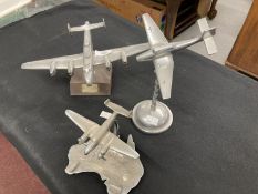 Collection of three aluminium models of aircraft on stands including a Lancaster and Stuka. (3)
