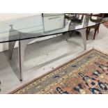 20th cent. Modern glass top table, possibly by Rolf Benz, oval egg shape top on a grey painted steel