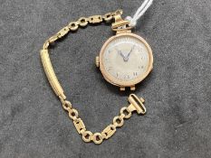 Hallmarked Jewellery: 9ct gold ladies wristwatch, silver coloured 25mm circular dial, black Arabic