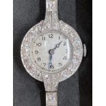 Jewellery: Early 20th cent. Ladies cocktail/evening watch. Diamond set dial (assessed 1.17ct) and