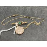 Jewellery: Yellow metal bar brooch set with a green paste, with leaf decoration, stamped 9ct and a