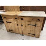 20th cent. Stripped pine cupboard/dresser base with marble top, two drawers over two doors.