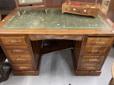 20th cent. Mahogany double pedestal desk, four drawers either side with carved handles, green