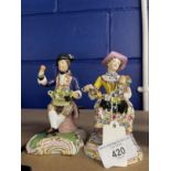 19th cent. Minton figures, a lady seated holding a garland of flowers, and a gentleman seated