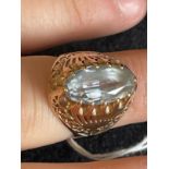 Jewellery: Yellow metal ring set with an oval cut aquamarine, estimated weight 2.75ct, tests as 14ct