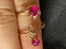 Jewellery: Yellow metal two dress rings both set with synthetic rubies, one with larger stone,