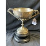 Hallmarked Silver: Trophy, double handles with melon decoration. Height 7ins. With a wooden