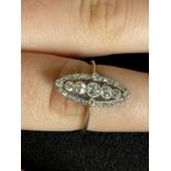 Jewellery: White metal Edwardian ring in the form of a Marquise shaped cluster set with thirty