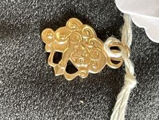 Jewellery: Yellow metal pendant in the form of a Cupid, tests as 14ct gold. Weight 5.1g.