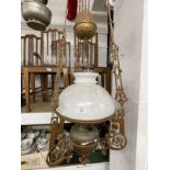 20th cent. Oil Lamps: Collection of oil lamps including five hanging lamps, one with a rise and fall