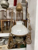 20th cent. Oil Lamps: Collection of oil lamps including five hanging lamps, one with a rise and fall