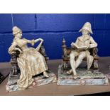Ceramics: Royal Dux figure pairing of a lady and gentleman sitting on two benches. 8½ins. x 7ins. (