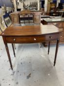 19th cent. Mahogany bow front side table on turned supports.
