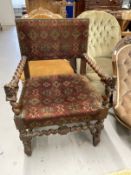 19th cent. Possibly Burmese oak carver chair, barley twist arms and column ending in lion hand