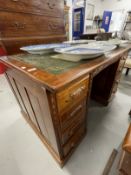 20th cent. Mahogany double pedestal desk, four drawers either side with carved handles, green