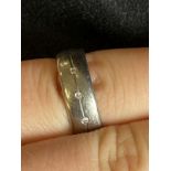Jewellery: Gentleman's three stone diamond titanium wedding band, size Q. 4.2g.