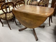 Early 19th cent. Mahogany oval dining table with two flaps on a baluster shaped column and four