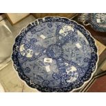 19th cent. Japanese Arita charger blue and white with wavy edge, central panel depicting mythical