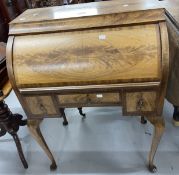 20th cent. Mahogany roll top desk, the roll top opens to reveal three drawers with three further