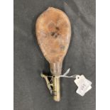 Shooting: 19th cent. Brass and leather shot powder flask, stamped Warranted leather.