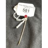 Jewellery: Yellow metal stock pin set with a single red tourmaline, estimated weight 1.25ct, tests