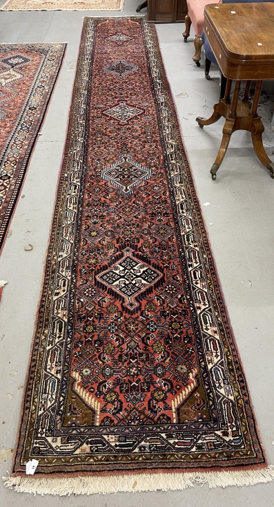 Rugs & Carpets: 20th cent. Runner, Asian style predominantly in red hues with striking blues and