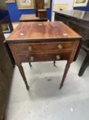 Early 19th cent. Mahogany work table with ebonised stringing on ring turned supports on brass