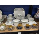 Art Deco Ceramics: Lawleys half tea service of geometric shape, pale blue and pink daisies