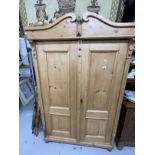 20th cent. Stripped pine Continental wardrobe, two doors. Approx. 77ins. x 49ins. x 21ins.