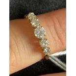 Jewellery: 18K gold five stone diamond ring (0.70 carats total). Ring size L. 2.5g.