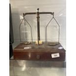 Scientific Instruments: Set of brass balance scales mounted on mahogany drawer base produced by