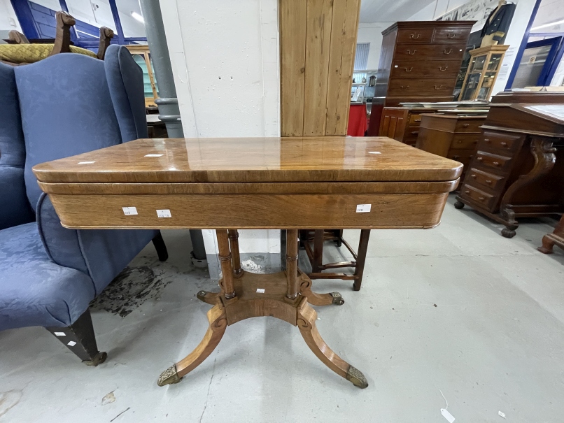 20th cent. Mahogany swivel top fold over card table, the four swept legs on brass castors supporting