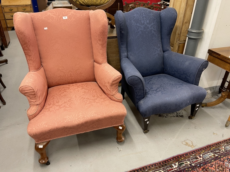 20th cent. Blue upholstered wingback armchair on square tapering front legs supported on brass