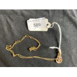 Jewellery: Yellow metal trace link chain with a pear drop pendant attached set with an amethyst