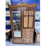 Arts & Crafts: Burr maple single wardrobe with stylised mons. 46ins. x 84½ins. x 18½ins. With