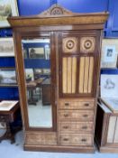 Arts & Crafts: Burr maple single wardrobe with stylised mons. 46ins. x 84½ins. x 18½ins. With
