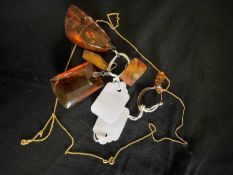Jewellery: Four amber items, two pendants, one earring and one ring, ring size N. Yellow metal