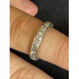 Jewellery: White metal ring set with twenty brilliant cut diamonds as a full eternity ring,