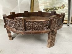 20th cent. Traditional Indian Chakki low table, the sides and supports carved profusely with