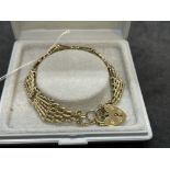 Hallmarked Jewellery: 9ct gold fancy link gate bracelet. Length 7ins. Width at widest point ½ins.