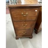 Georgian mahogany three narrow drawer chest of drawers on bracket supports, with original brass