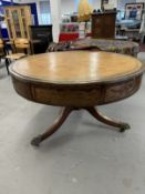 19th/20th cent. Mahogany drum table on column support terminating in brass claw feet and castors.