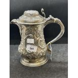 Silver & Plated Ware: George III white metal lidded jug with embossed floral decoration and having a