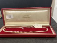 Jewellery: Necklet single row of (87) graduated cultured pearls with a silver clasp, pearls