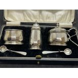 Hallmarked Silver: Five-piece condiment set with blue glass liners in fitted case. Weight 2oz. Not