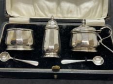 Hallmarked Silver: Five-piece condiment set with blue glass liners in fitted case. Weight 2oz. Not
