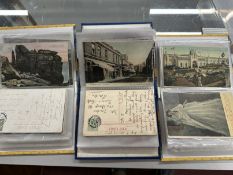 Postcards: More than 150 cards in three small albums featuring towns and villages in West and