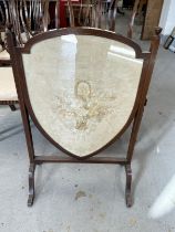 19th cent. Mahogany fire screen with needlepoint floral design within a shield.